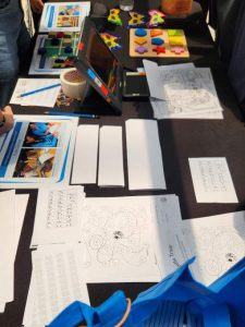 We had a range of fun activities catering to all ages (decode the code, a braille activity; tactile tic tac toe; picture search using handheld magnifier) to demonstrate how our students with visual impairment can access information and learn.