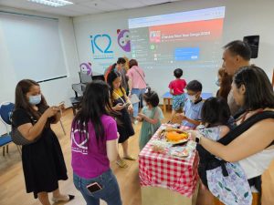 The event was lively with a traditional Lohei, where parents, kids, staff of iC2, and directors celebrated together, symbolizing unity and prosperity.