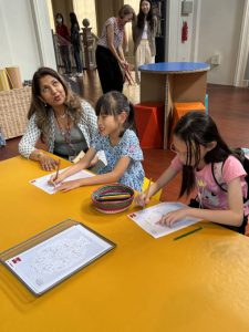 iC2 students and their families were treated to an enriching guided touch tour at the Asian Civilisations Museum’s captivating exhibition, “Manila Galleon: From Asia to Americas”.