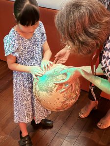 iC2 students and their families were treated to an enriching guided touch tour at the Asian Civilisations Museum’s captivating exhibition, “Manila Galleon: From Asia to Americas”.