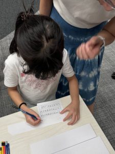A young participant is attempting to decode the given quotes.