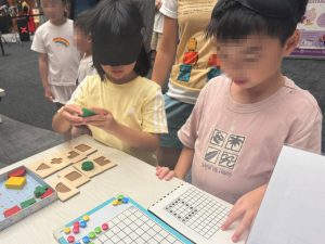 Visitors are engaging in activities such as solving various puzzles while blindfolded