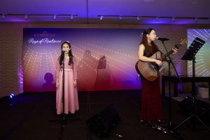 A vibrant musical performance by one of our students, Anisah, and our dedicated volunteer, Stephanie