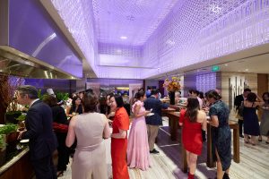 Guests enjoying lively conversations over canapés and drinks