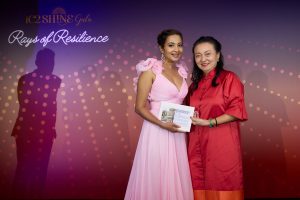 Ms Goh Shuet-Li presenting the first raffle prize, A 2-night family stay at Mandai Rainforest Resort, to our lucky winner