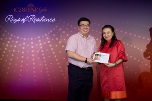 Ms Goh Shuet-Li presenting the third raffle prize, A 3-Month PURE Membership, to our lucky winner