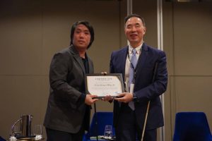 Joshua Tseng presents a Certificate of Appreciation to iC2 Chairman, A/Prof Wong Meng Ee