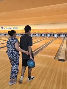One of our beneficiaries and his mother had a fun evening of strikes, spares, and community spirit.
