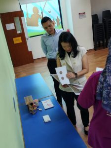 CEO of SG Enable visit: Braille introduction by teacher Farah