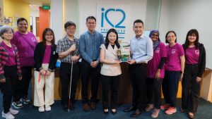 Our Executive Director, Mr Edwin Lim, presented Ms Lee with our coffee table book, which captures the heart of our mission and the stories of those we serve.