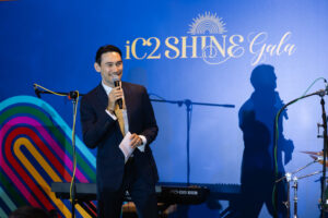 Paul Foster, our charismatic emcee, energizing the crowd at the iC2 SHINE Gala 2026